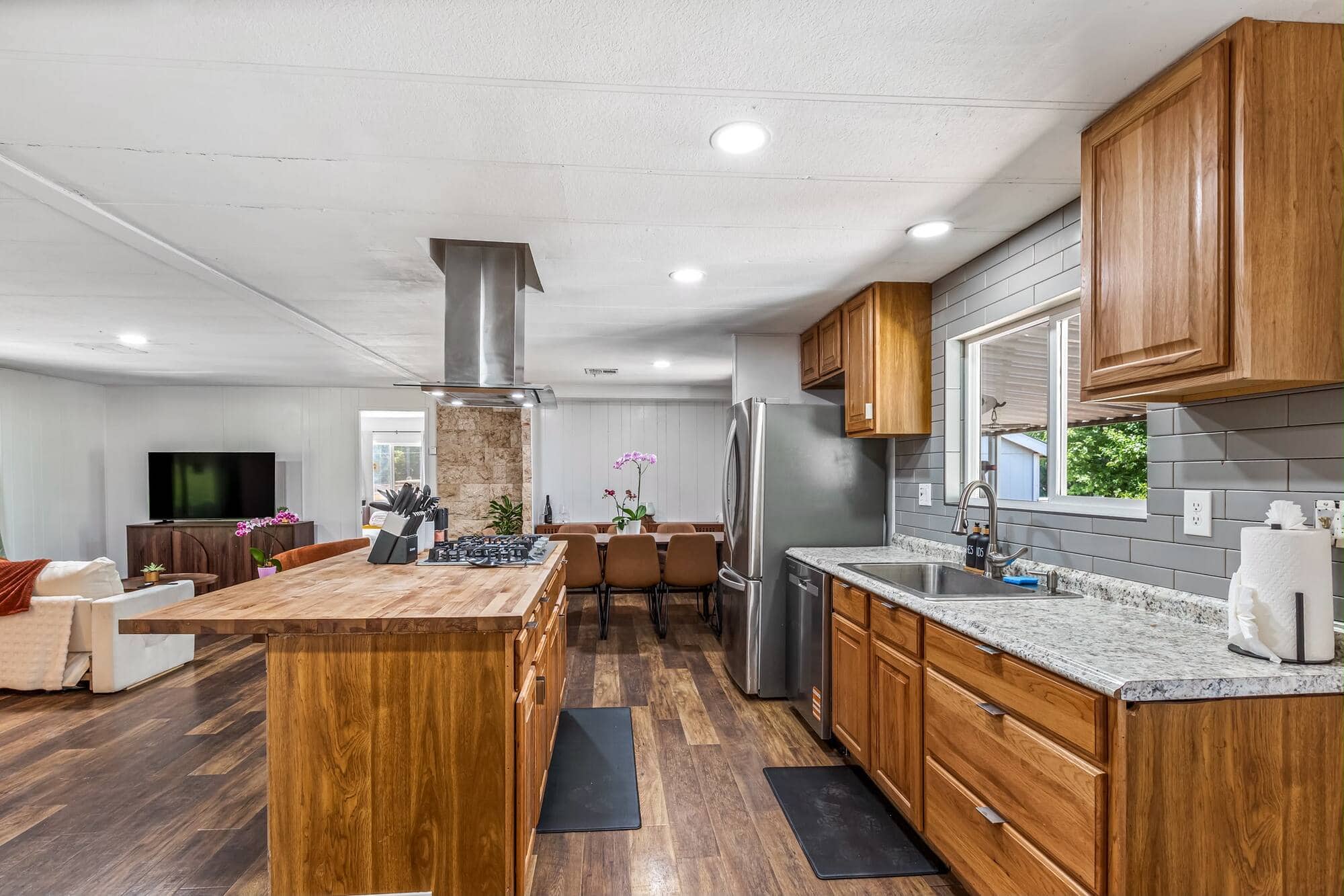 A butcher-block kitchen island and range cleaned and staged