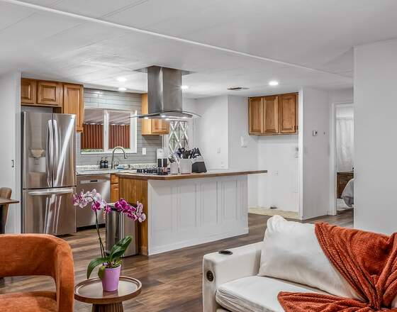 An open-plan living and dining room cleaned and staged